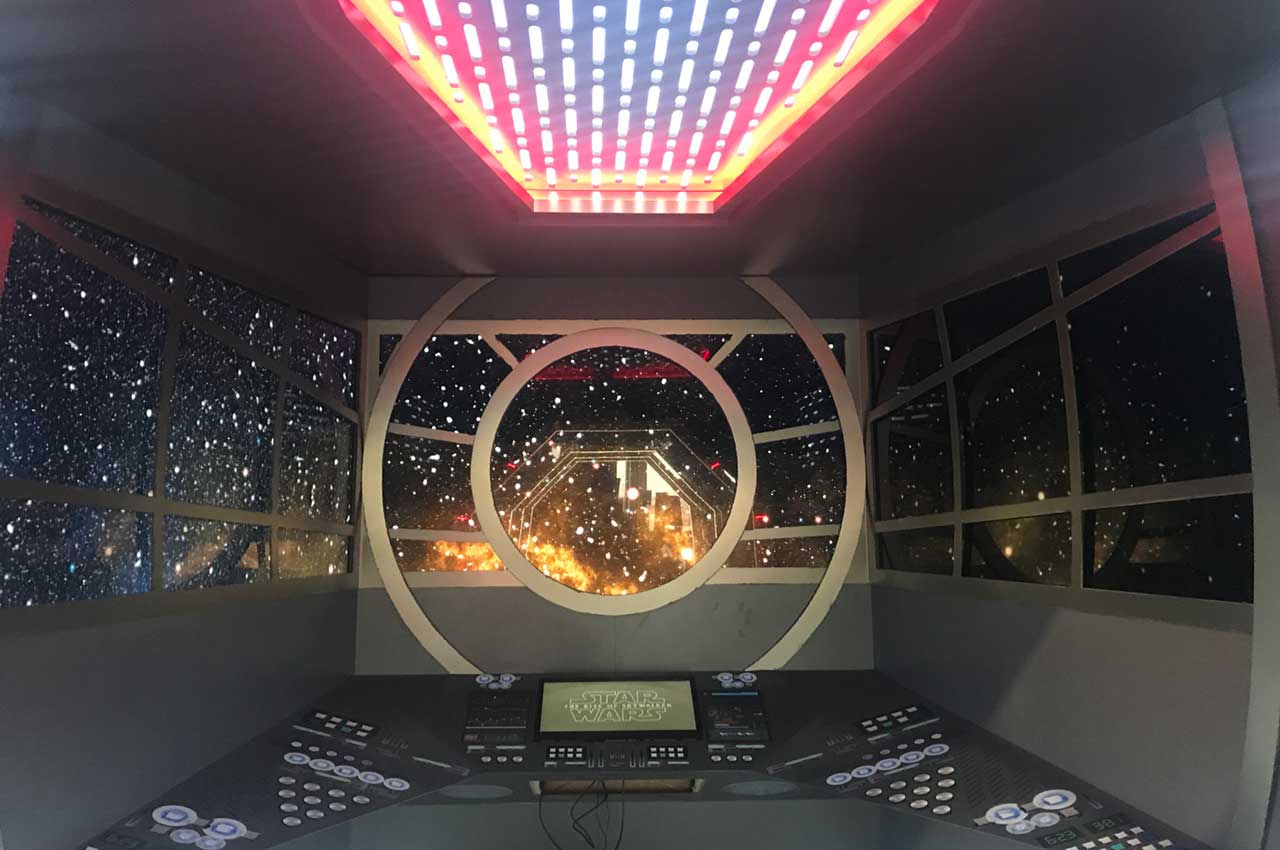 Cockpit on the Millenium Falcon with three windows displaying the view in space (with video)